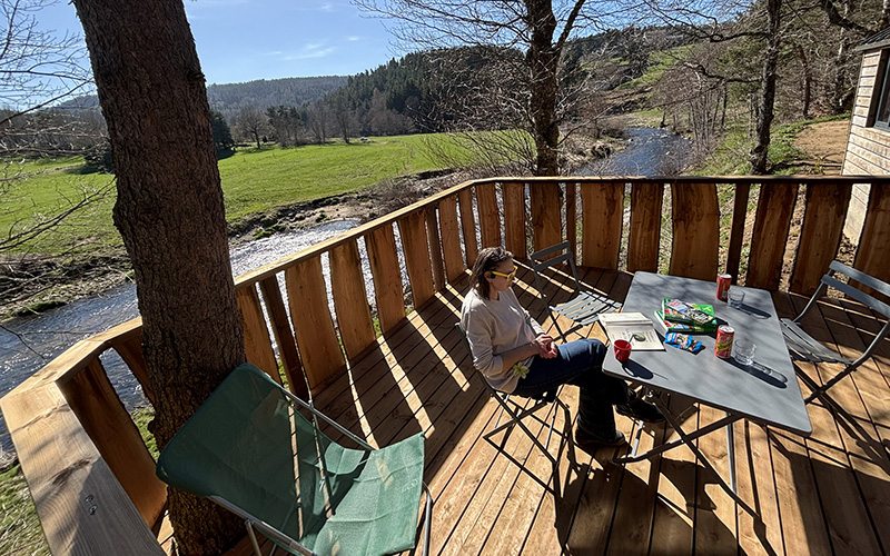 The Roulotte terrace, unique accommodation in Haute-Loire, for rent at Les Murmures du Lignon campsite