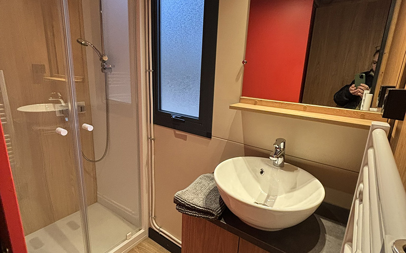 Bathroom of the Roulotte, unique accommodation in Auvergne, for rent at Les Murmures du Lignon campsite